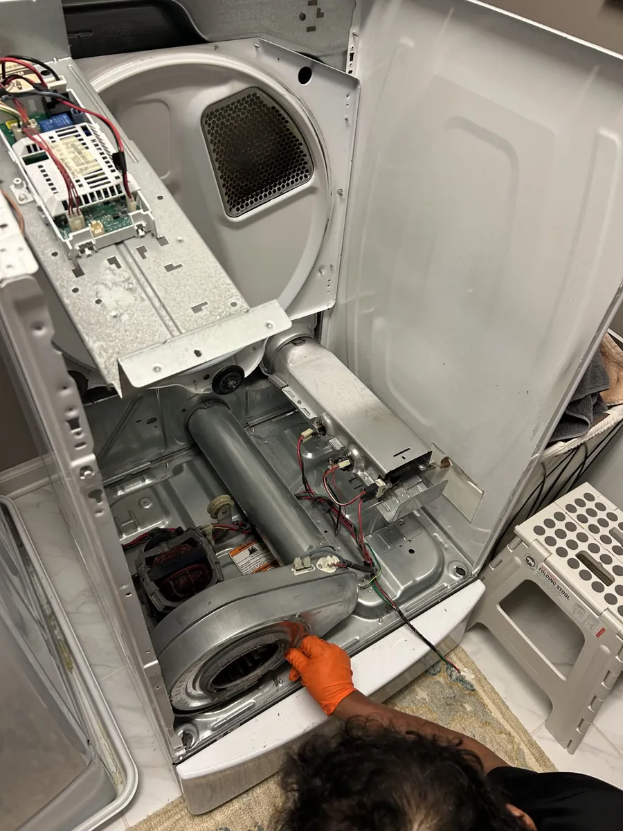 Dryer opened up for repair, drum removed